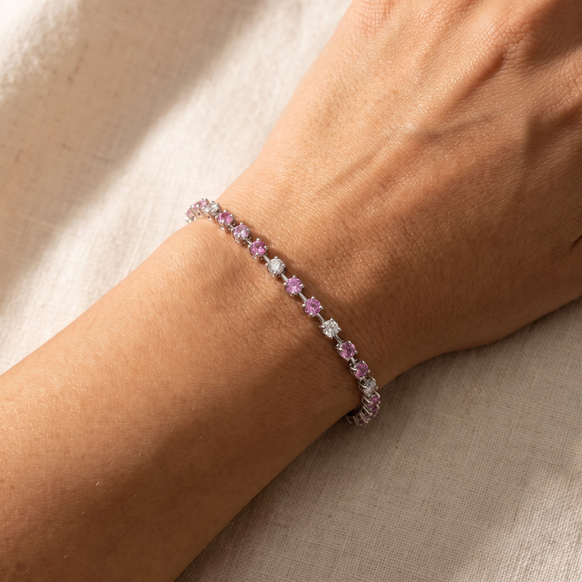 Medium Pink Sapphire Tennis Bracelet in White Gold, worn