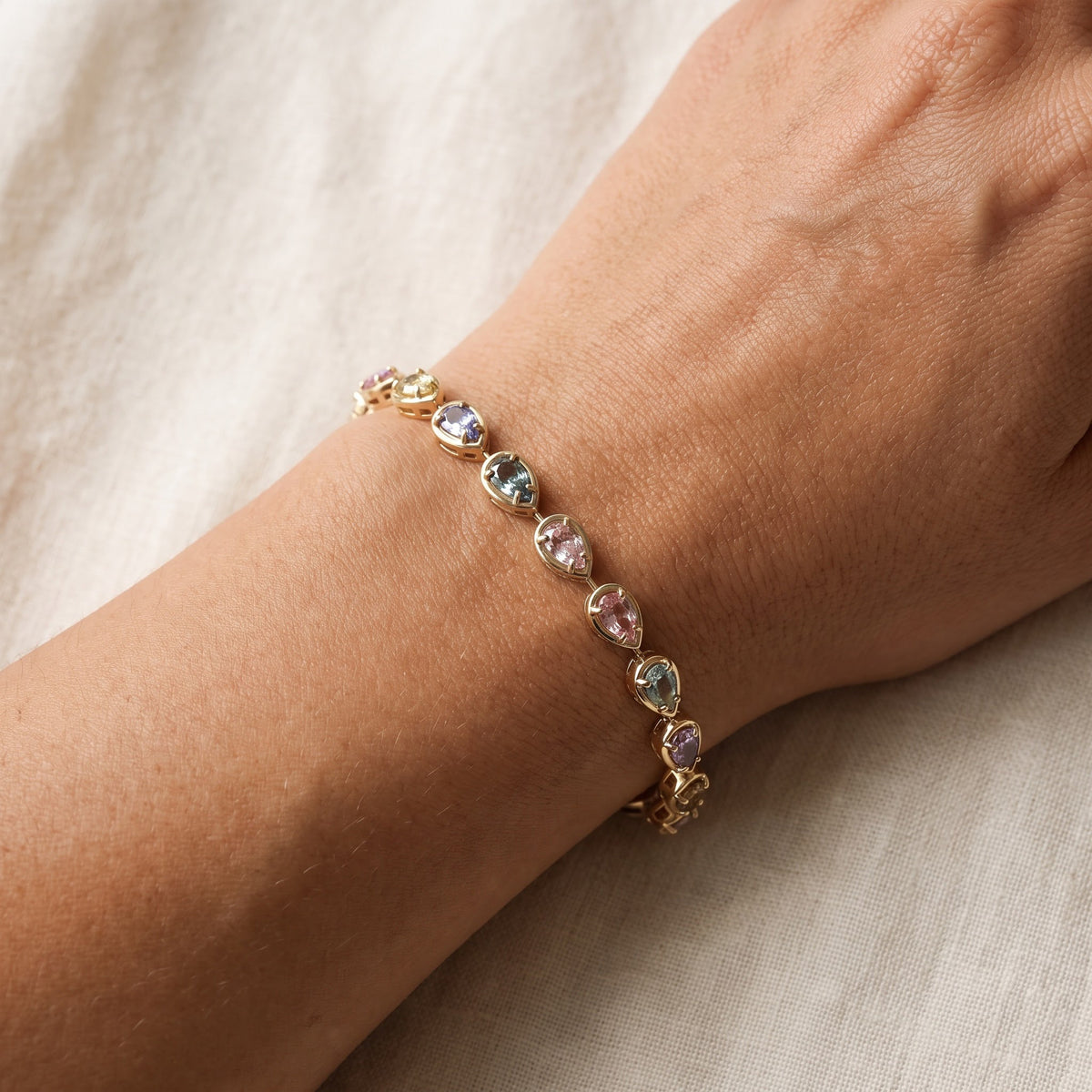 Multi-Color Pear Shape Sapphire Chain Bracelet in Yellow Gold, worn
