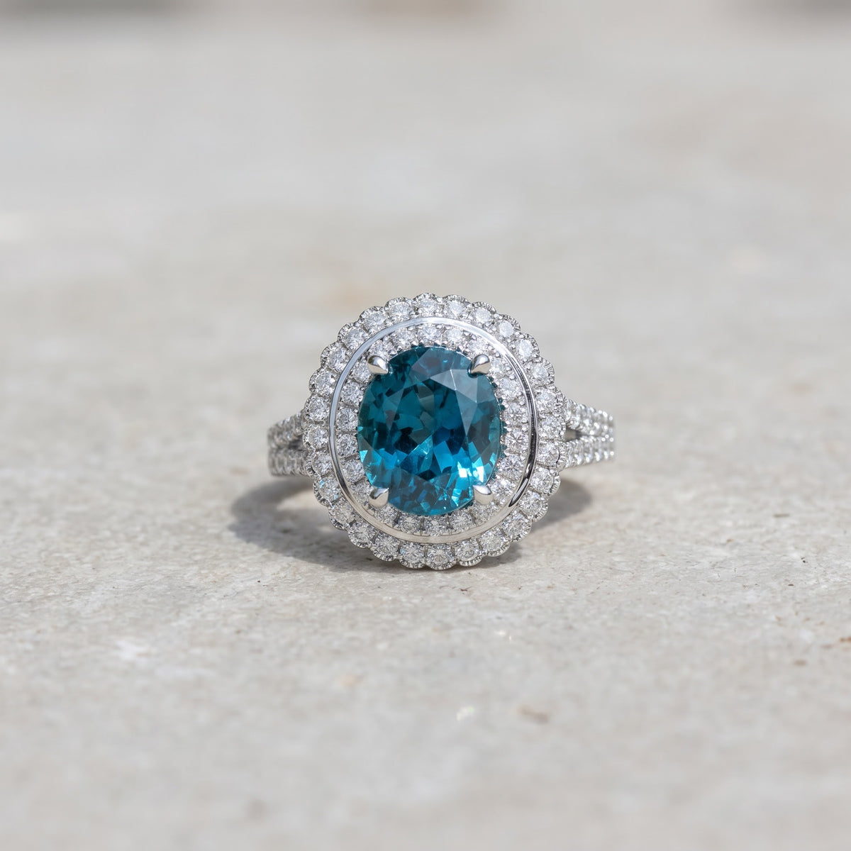 5.24 ct Oval Blue Zircon and Diamond Double Halo Cocktail Ring in 14K White Gold