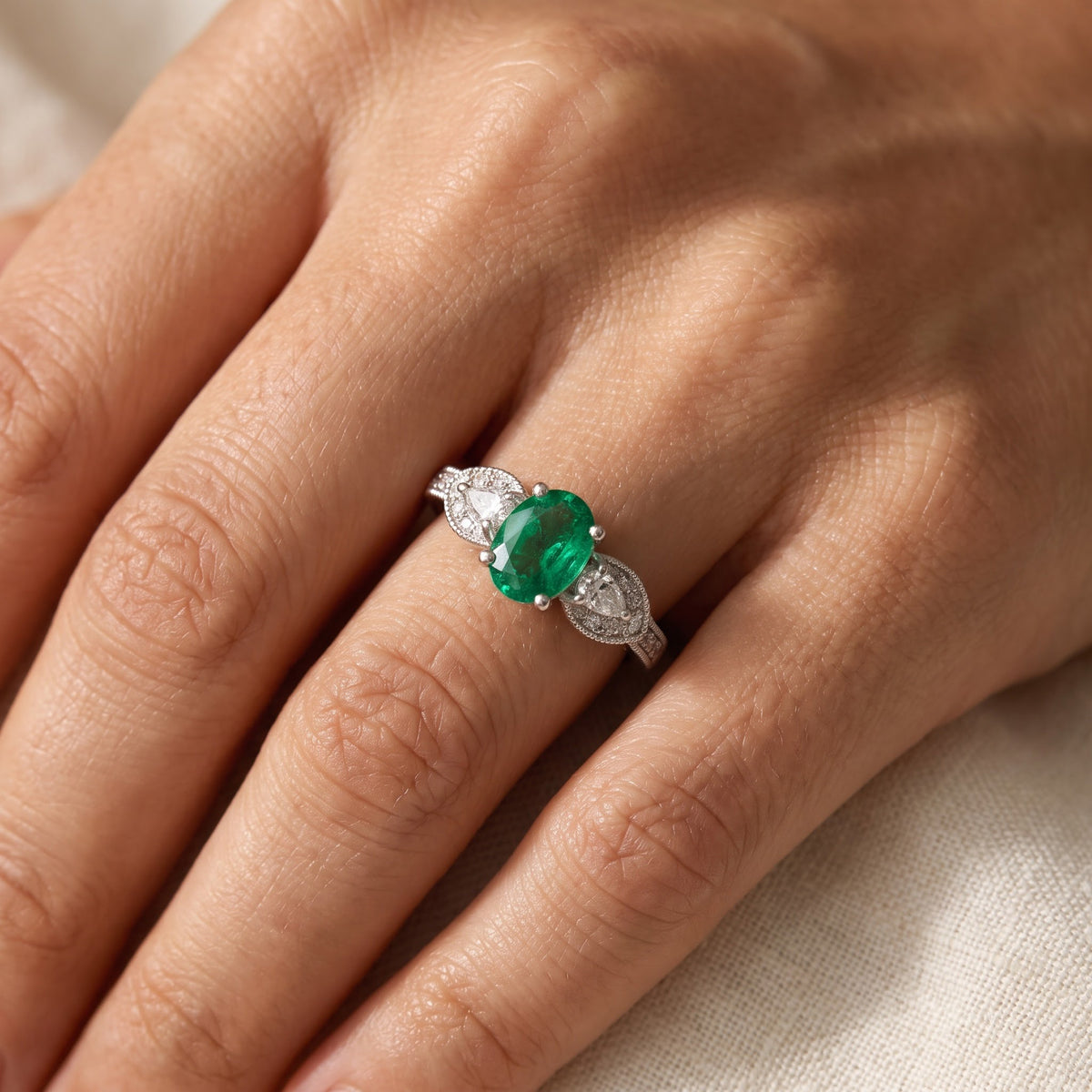 Oval Emerald and Diamond Ring in White Gold, worn