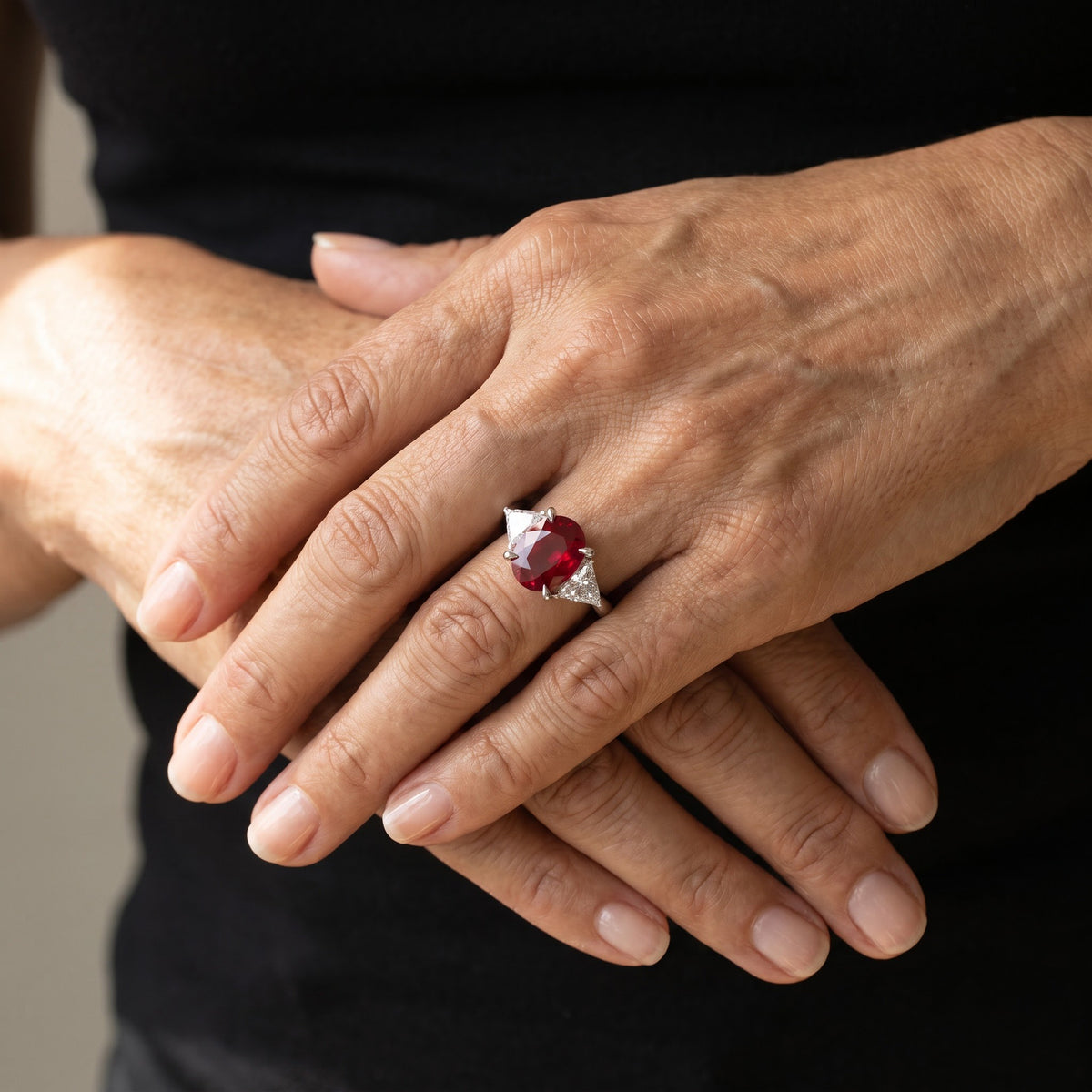Oval Pigeon Blood Ruby Three-Stone Ring in White Gold, worn