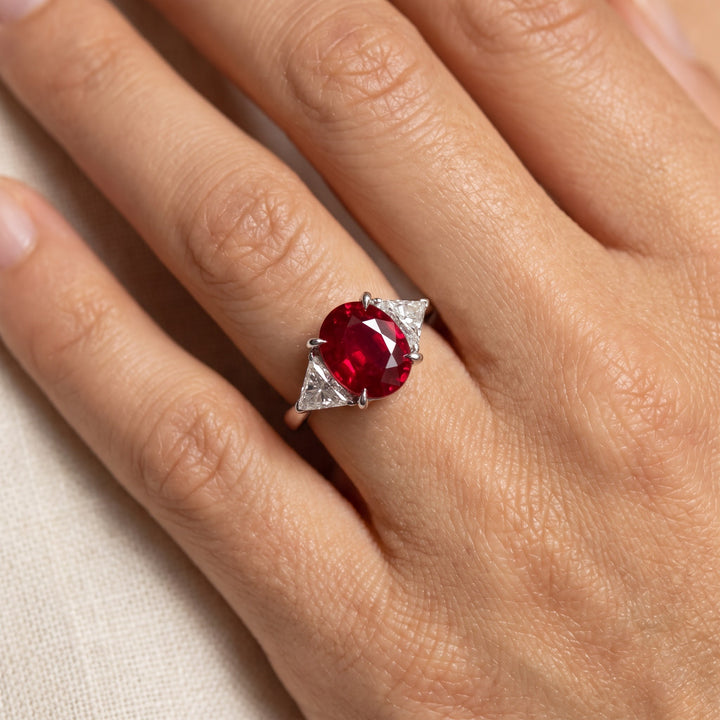 Oval Pigeon Blood Ruby Three-Stone Ring in White Gold, worn
