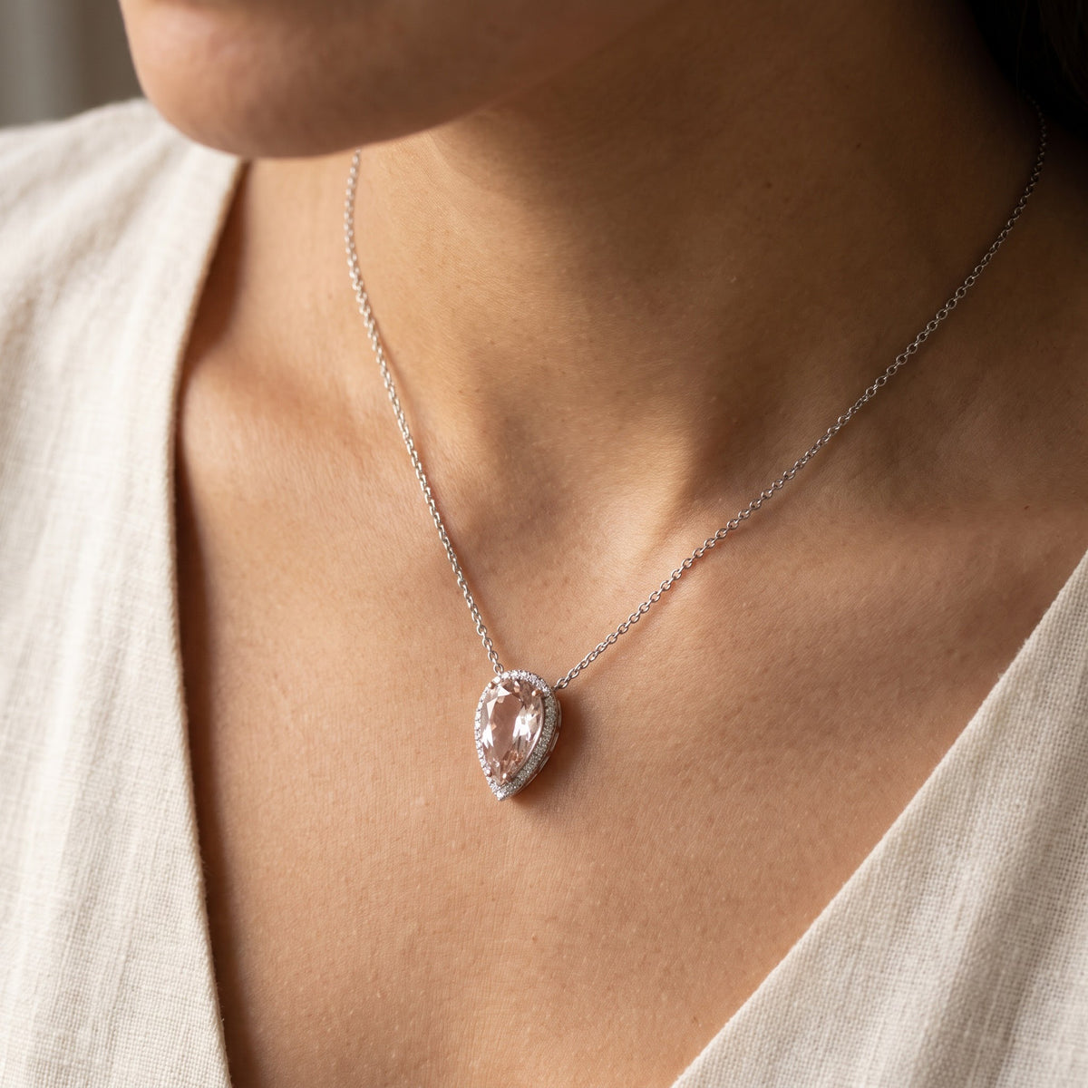 Pear Cut Morganite Halo Pendant Necklace in White Gold, worn