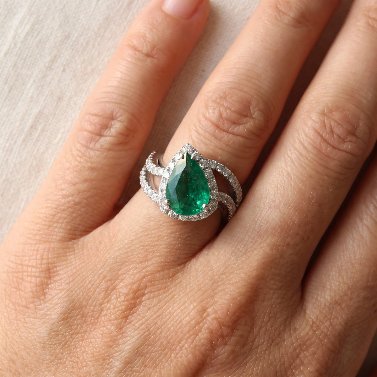 Pear-Shaped Emerald Halo Cocktail Ring in White Gold, worn