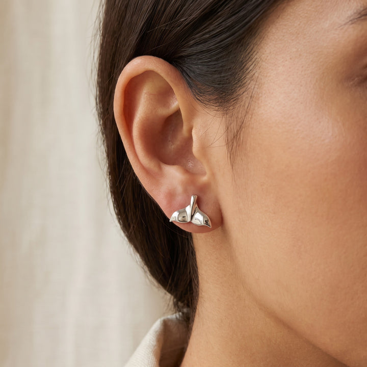 Polished Whale Tail Stud Earrings in 14K White Gold, worn