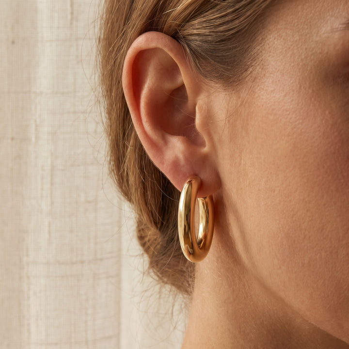 Polished Chunky Hoop Earrings in 14K Yellow Gold, worn