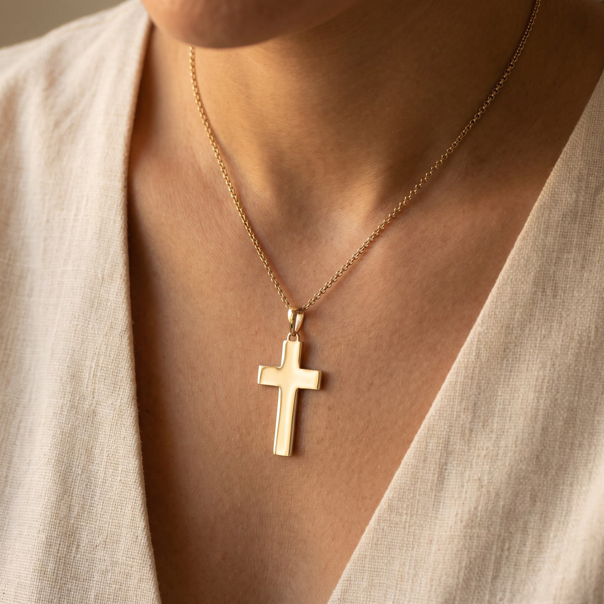 Polished Yellow Gold Cross Pendant Necklace, worn