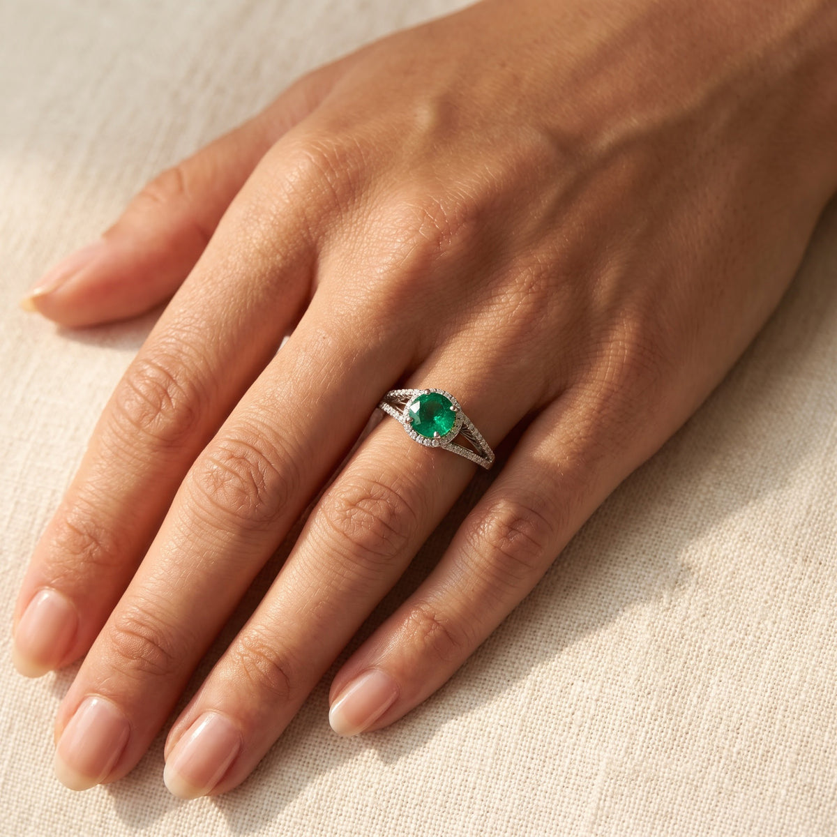 Round Emerald Halo Split Shank Ring in White Gold, worn
