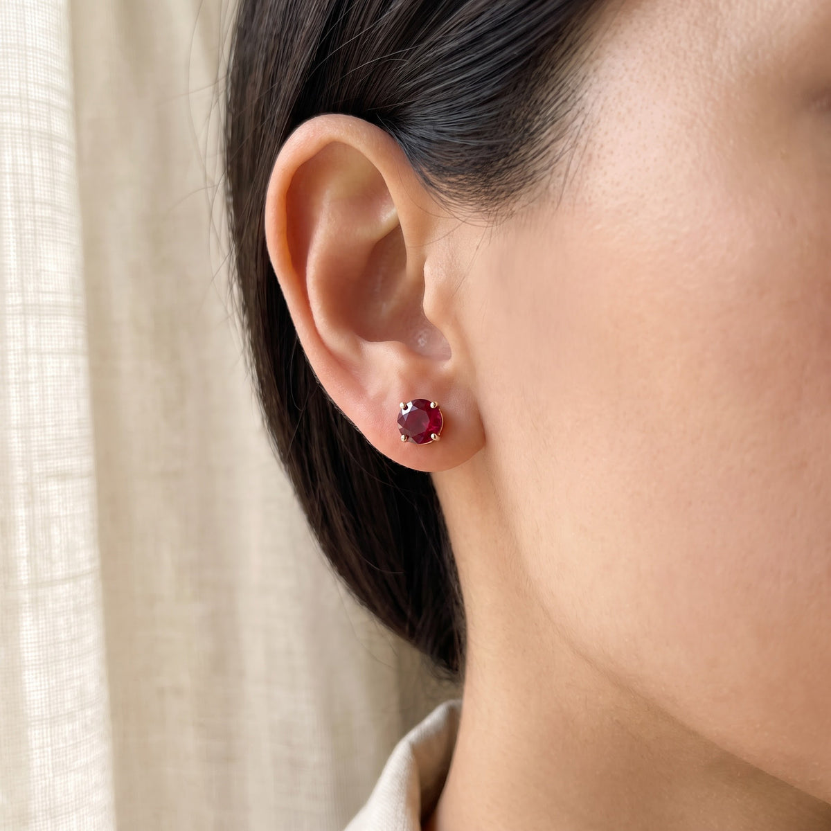 Round Ruby Stud Earrings in 14K Yellow Gold, worn