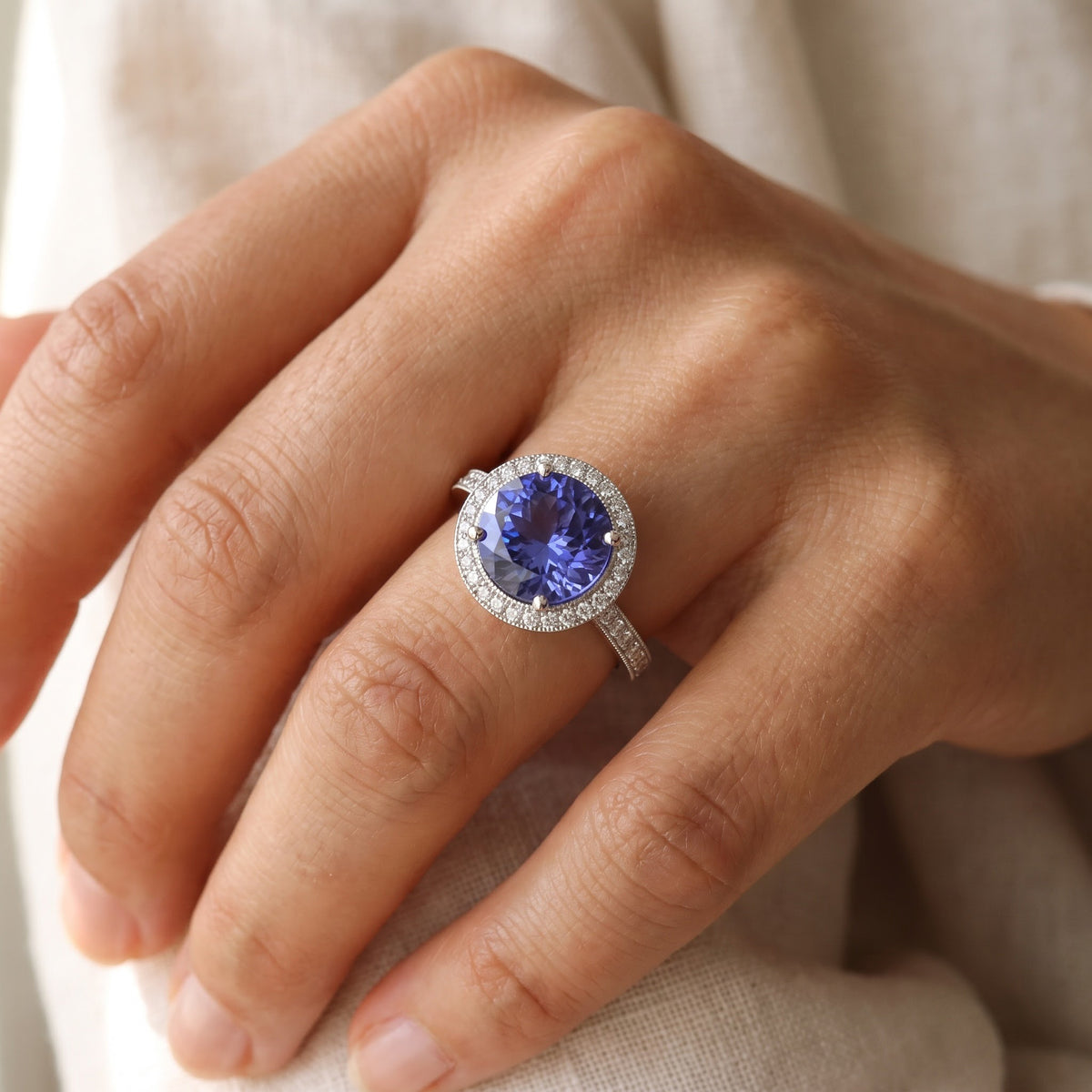 Round Tanzanite and Diamond Halo Ring in White Gold, worn