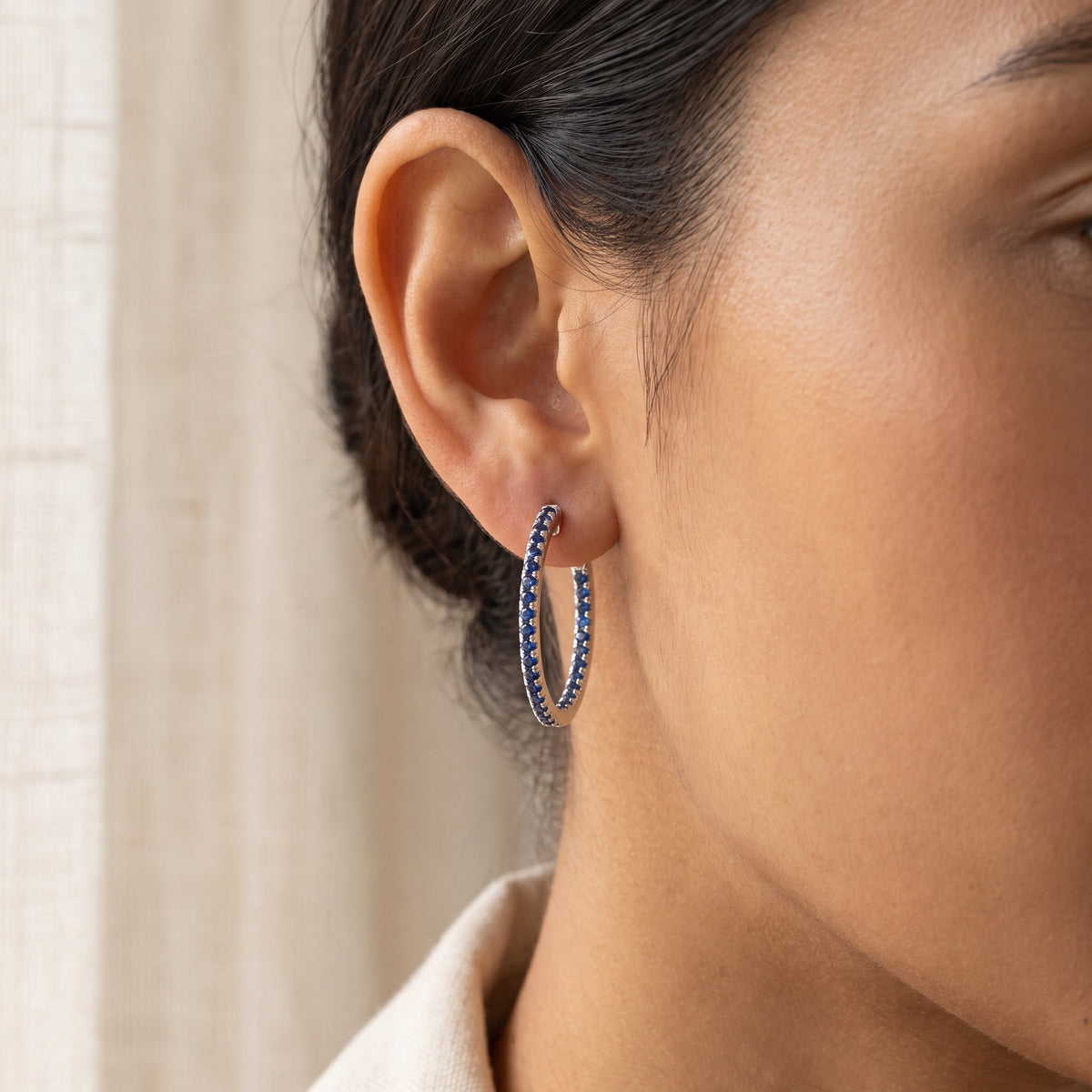 Royal Blue Sapphire Hoop Earrings in White Gold, worn