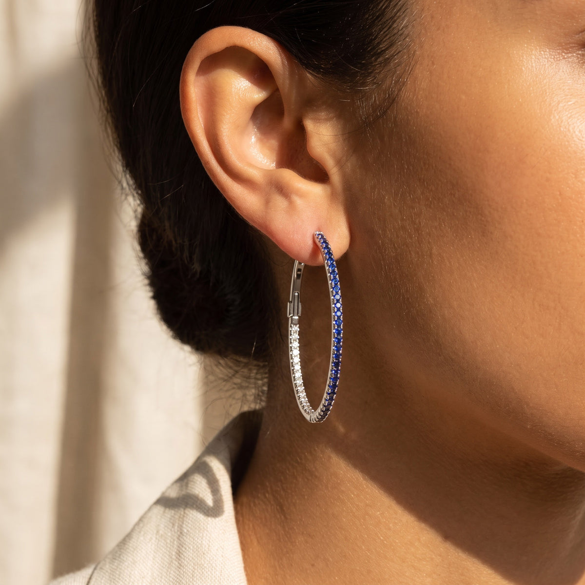 Royal Blue Sapphire Inside-Out Hoop Earrings in White Gold, worn