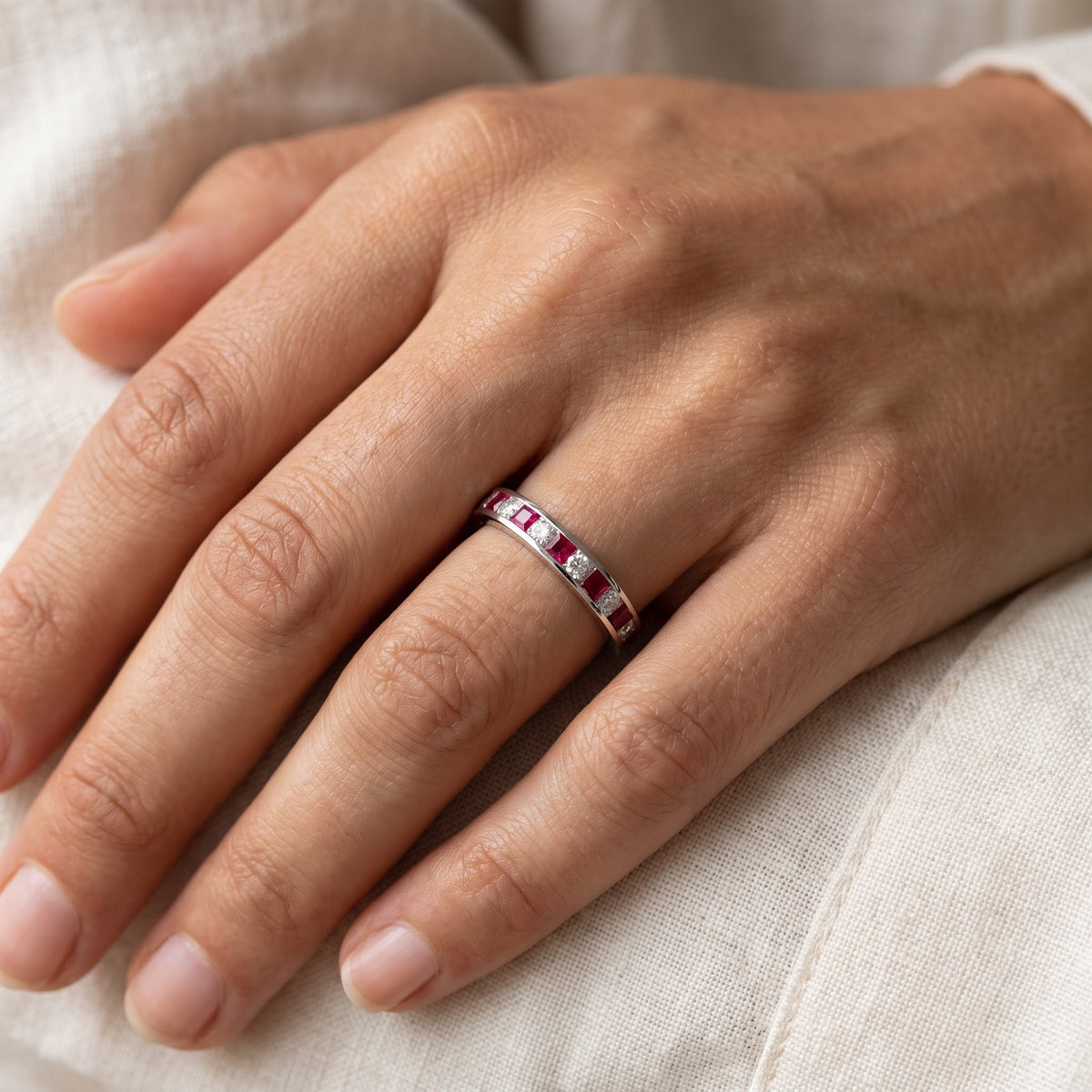 Ruby and Diamond Channel Set Band in White Gold, worn