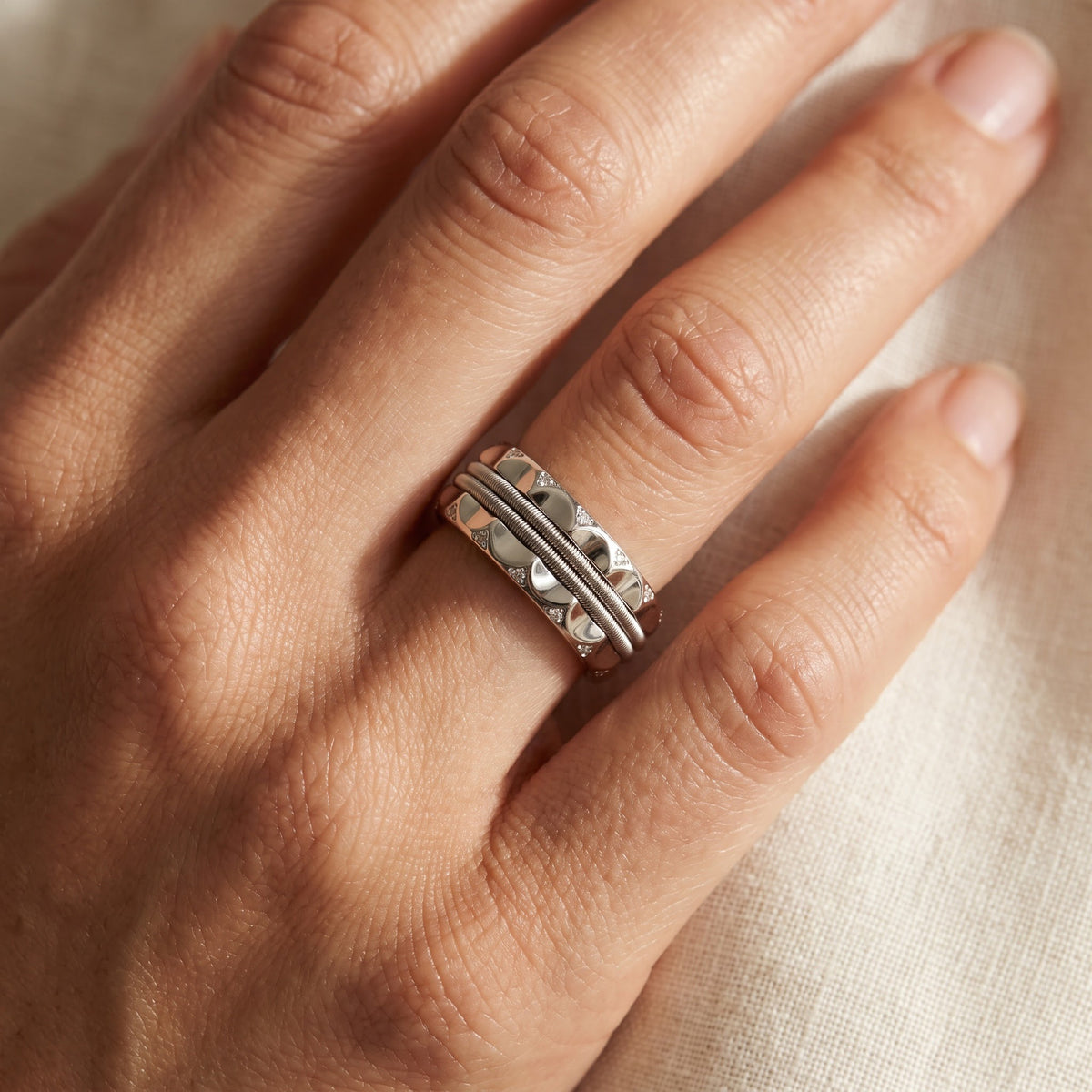 Scalloped White Gold Diamond Band Ring with Textured Center, worn
