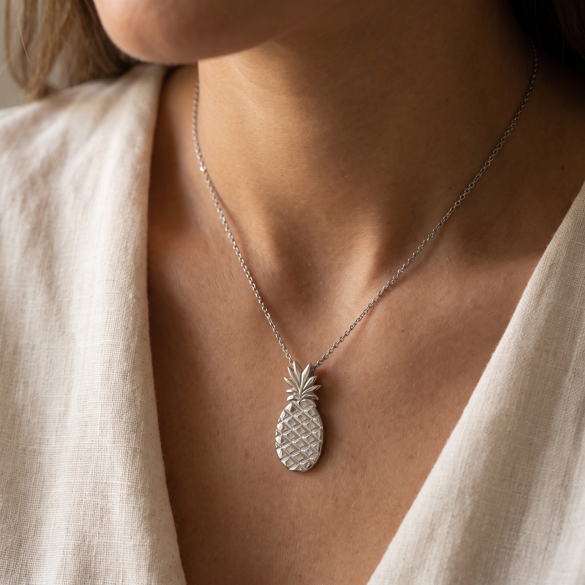 Textured Pineapple Charm Necklace in White Gold, worn