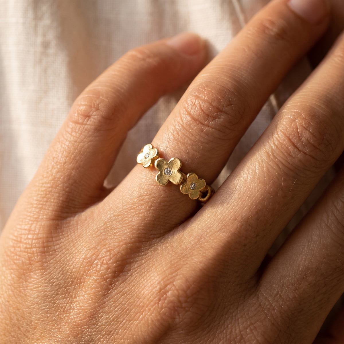 Three-Flower Diamond Stackable Ring in 18K Yellow Gold, worn