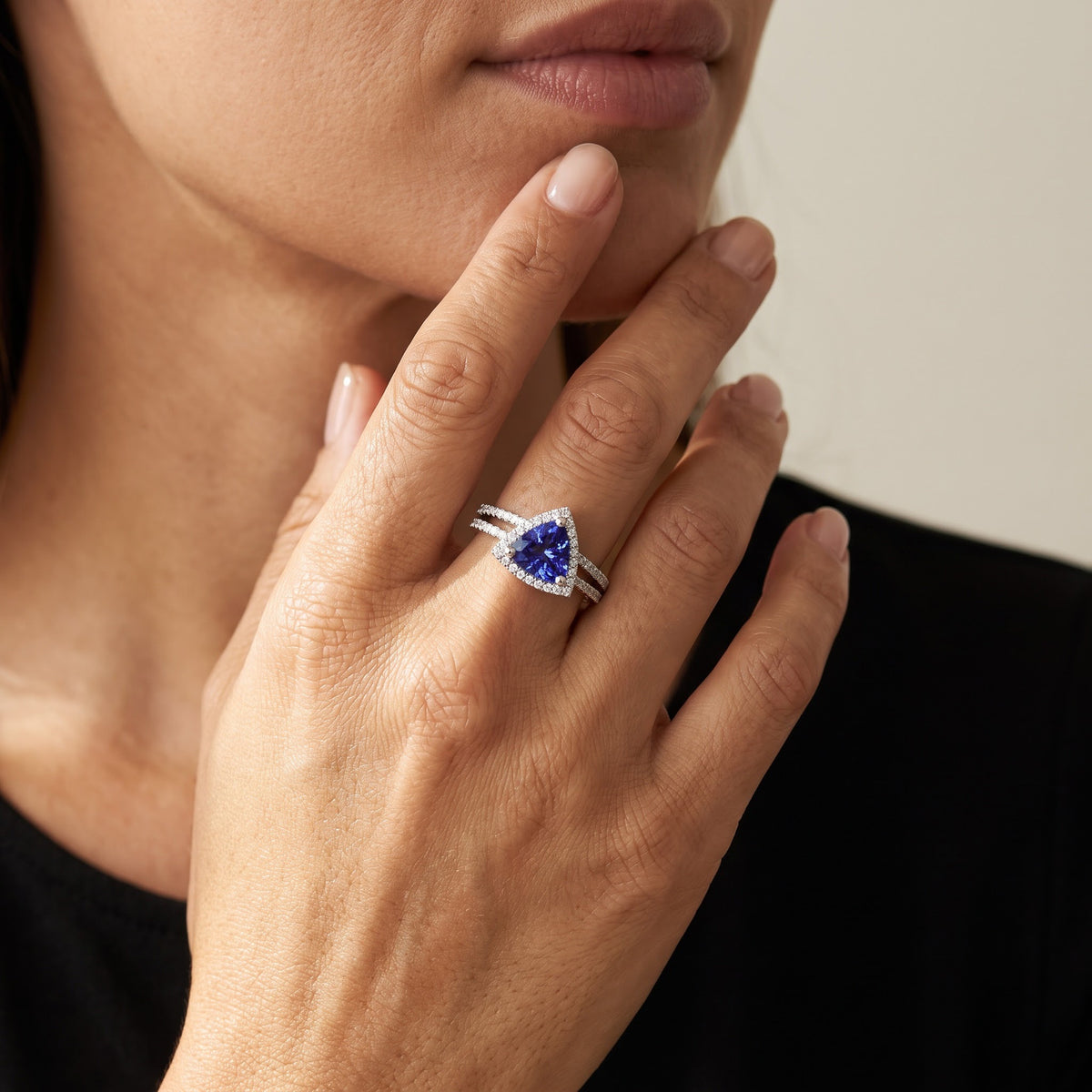 Trilliant Cut Tanzanite Halo Ring in White Gold, worn, second view
