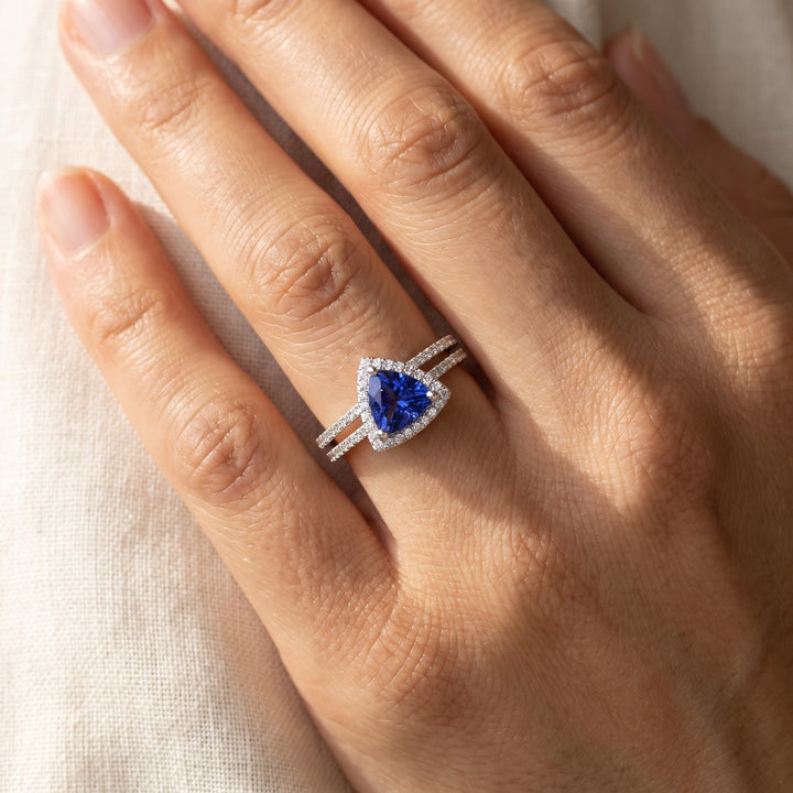1.29 ct Trilliant Cut Tanzanite and Diamond Halo Ring in 14K White Gold, worn