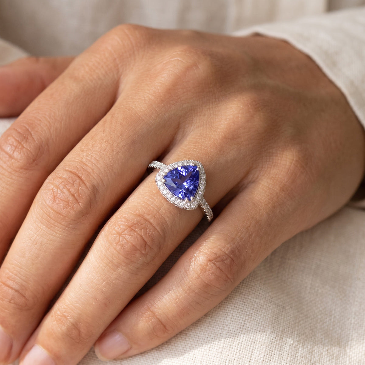 Trillion-Cut Tanzanite Halo Cocktail Ring in White Gold, worn