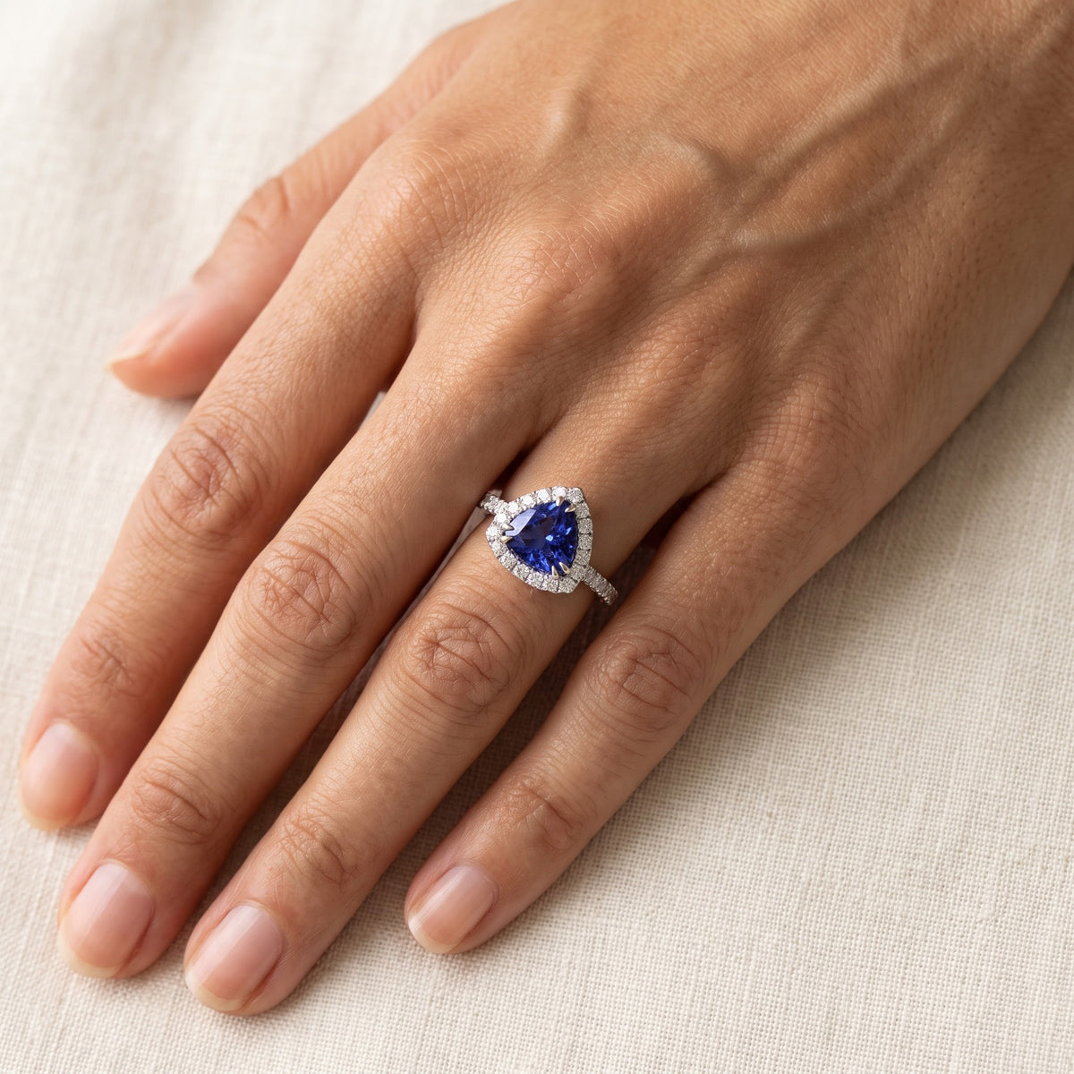 Trillion Cut Tanzanite Halo Cocktail Ring in White Gold, worn