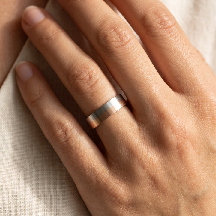 Two-Tone Brushed Finish Flat Wedding Band in 14K White and Rose Gold, worn