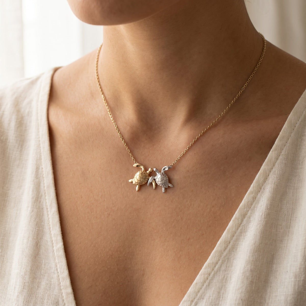 Two-Tone Sea Turtle Charm Necklace in Yellow and White Gold, worn