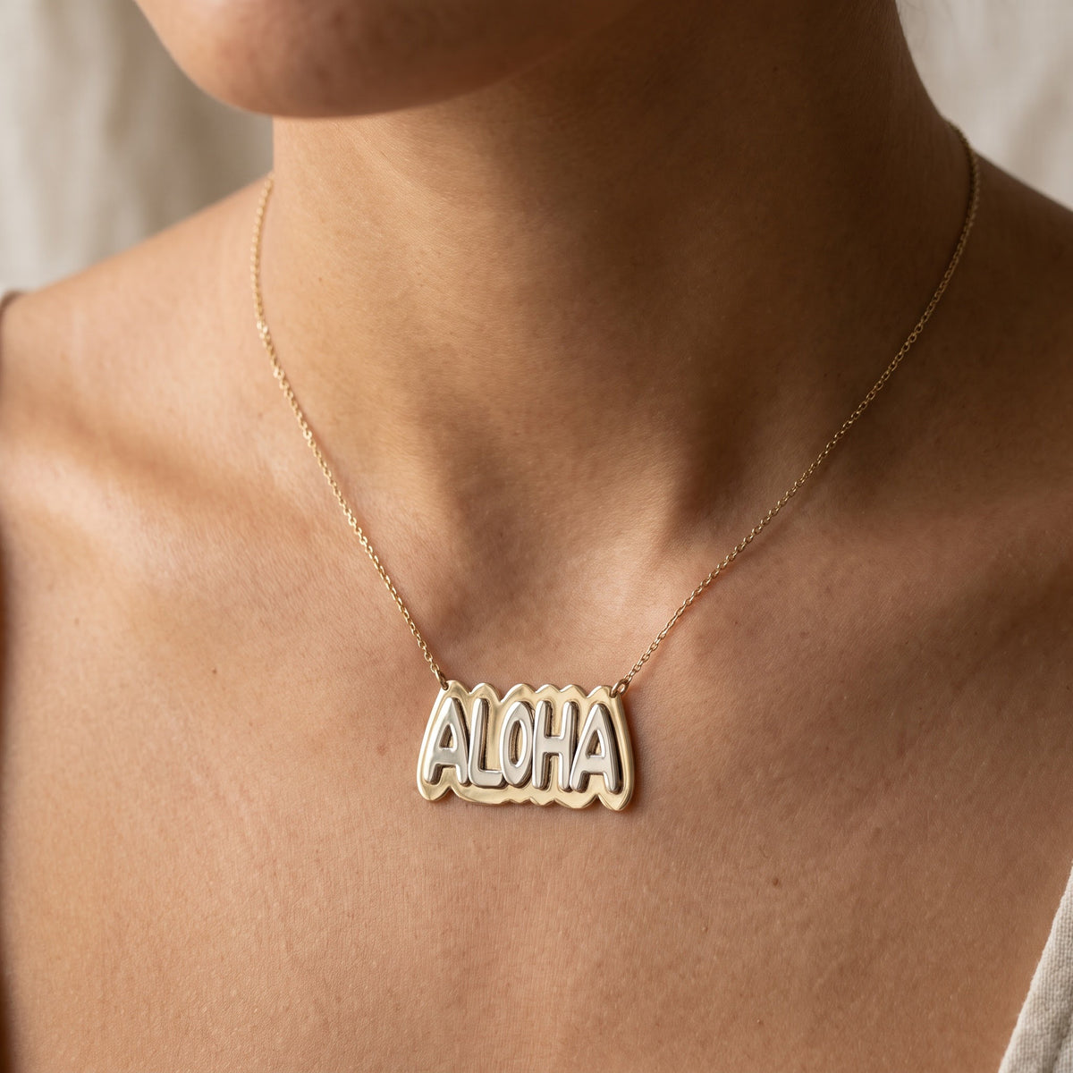 Two-Tone Yellow Gold Aloha Word Necklace, worn