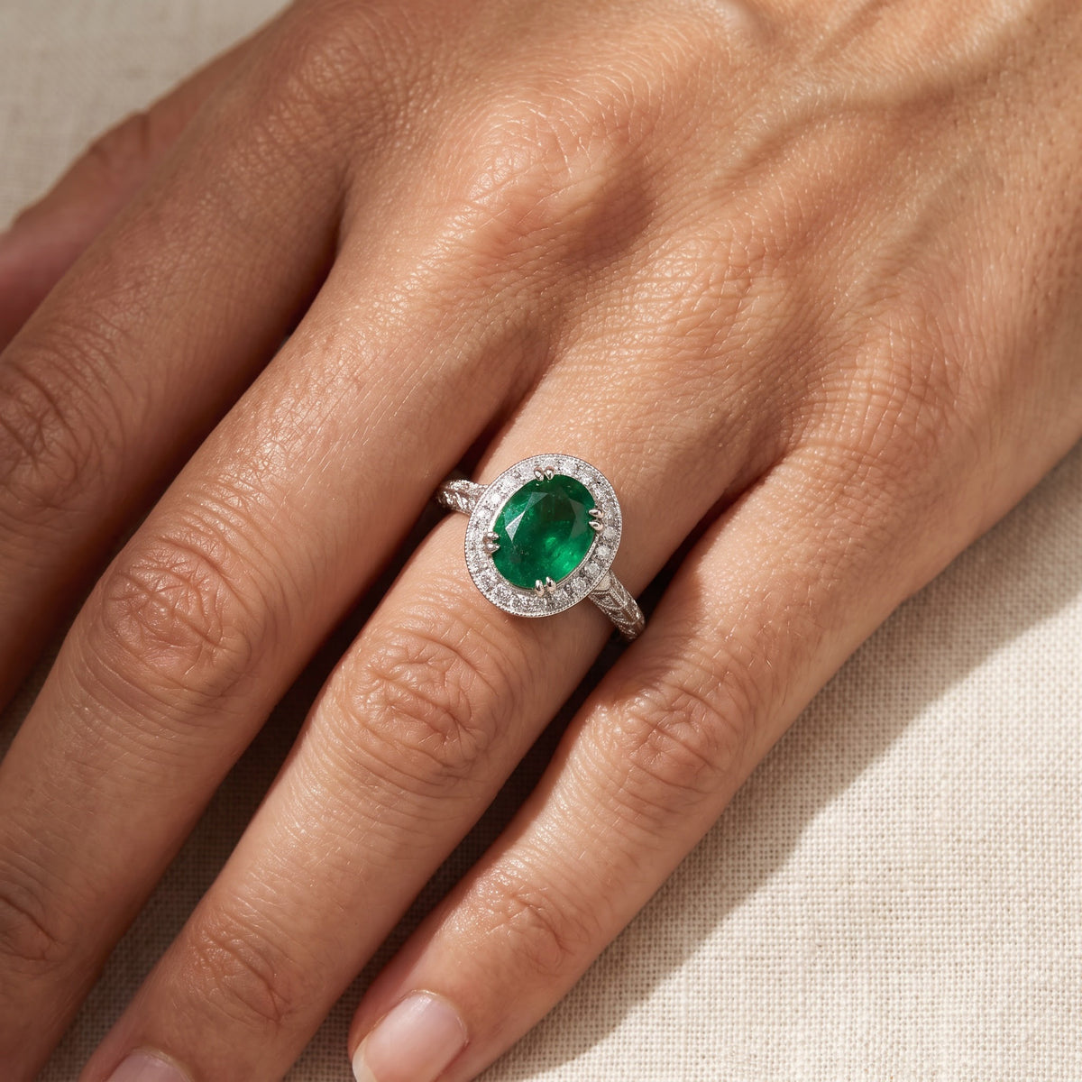 Vintage-Inspired Emerald Halo Cocktail Ring in White Gold, worn