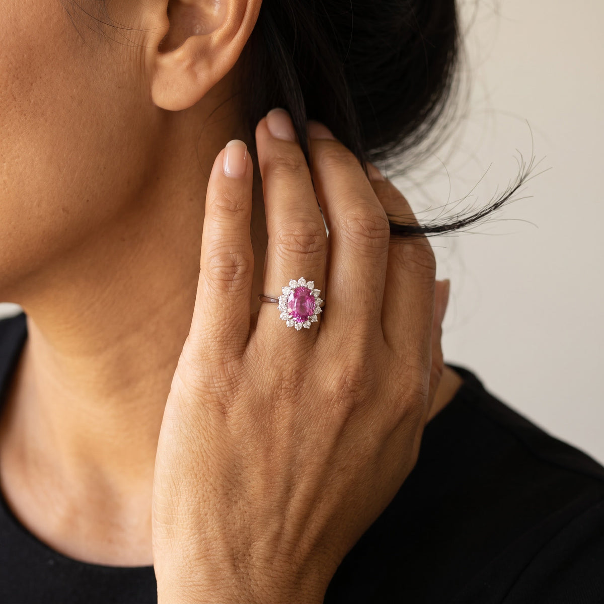 Vivid Pink Sapphire Halo Cocktail Ring in White Gold, worn
