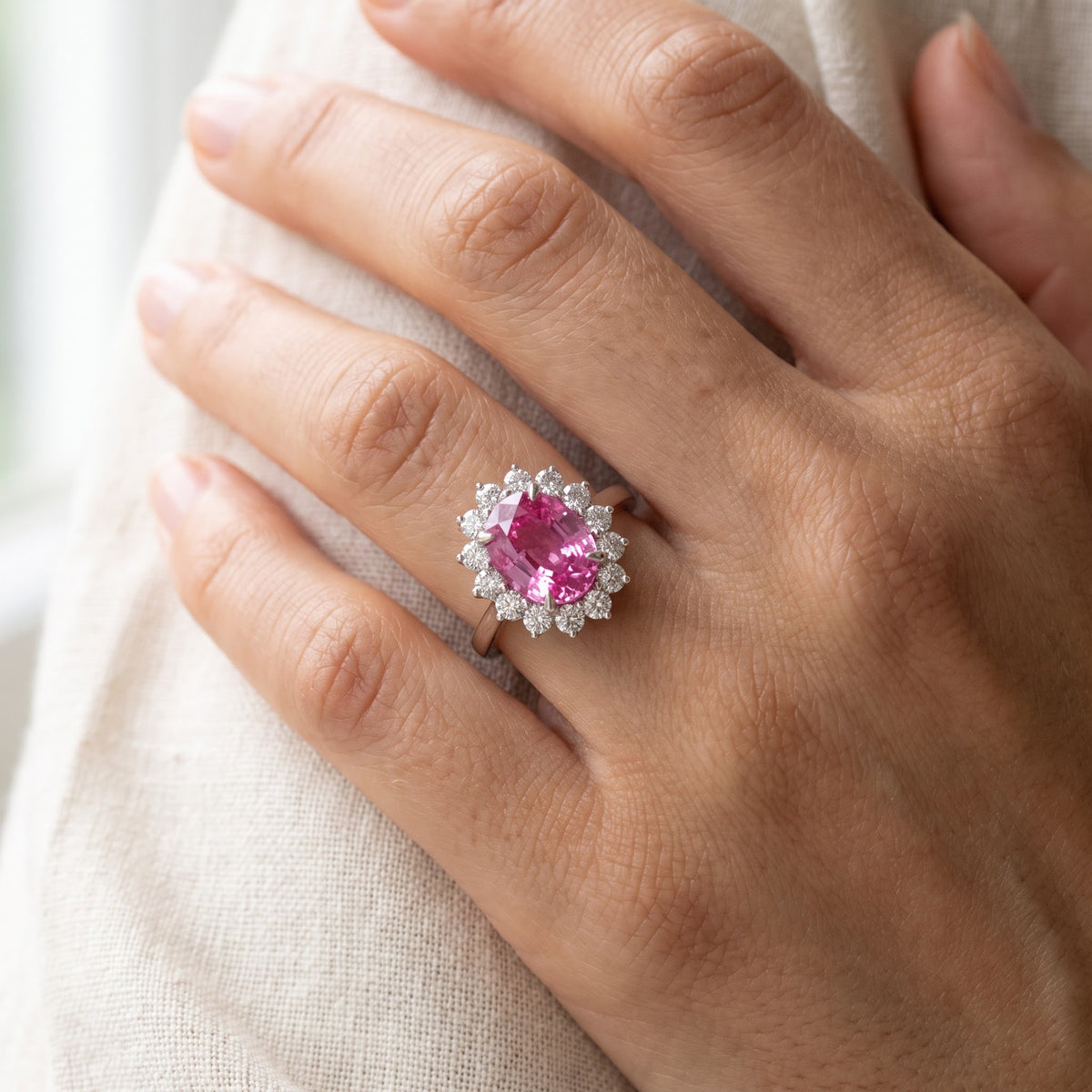Vivid Pink Sapphire Halo Cocktail Ring in White Gold, worn