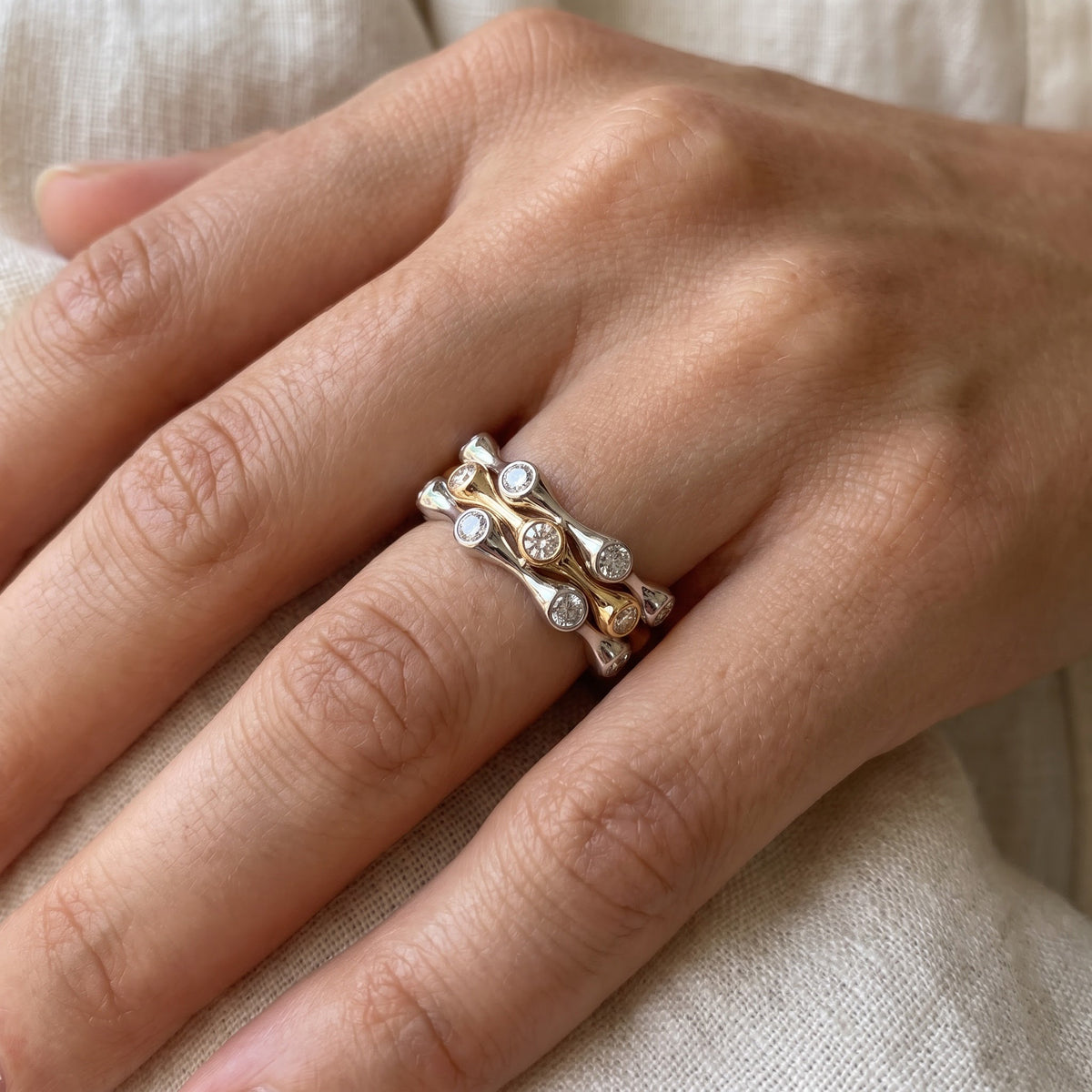 Wavy Two-Tone Diamond Stackable Ring in 14K White and Yellow Gold, worn