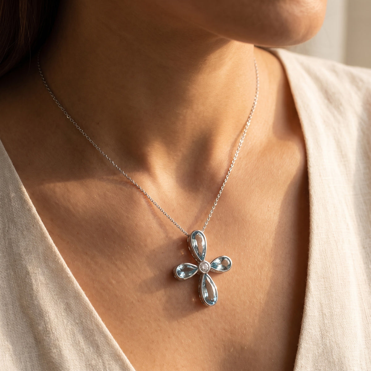 White Gold Aquamarine Cross Pendant Necklace, worn