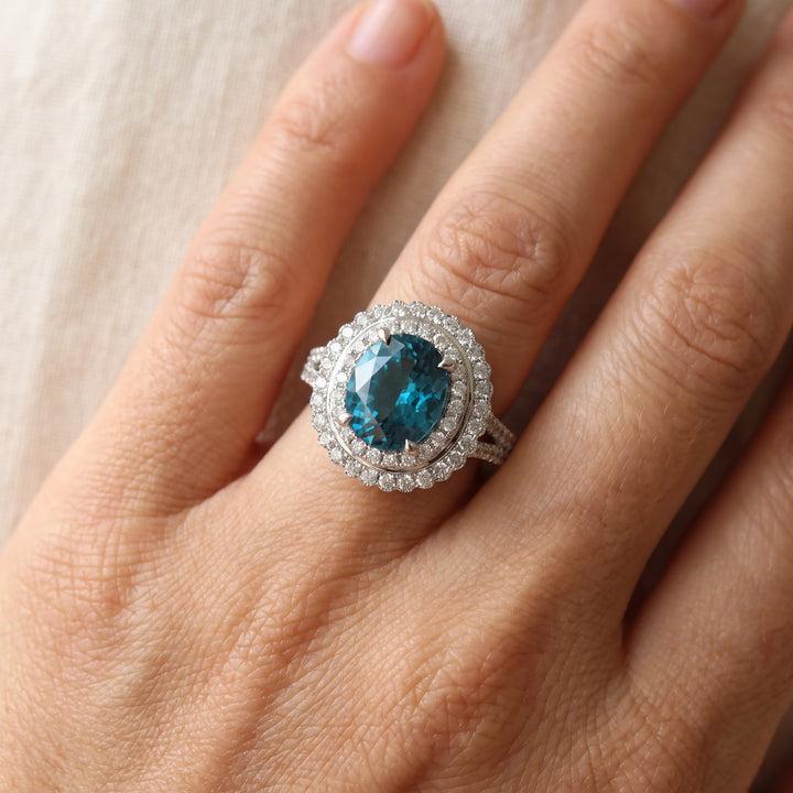 5.24 ct Oval Blue Zircon and Diamond Double Halo Cocktail Ring in 14K White Gold, worn