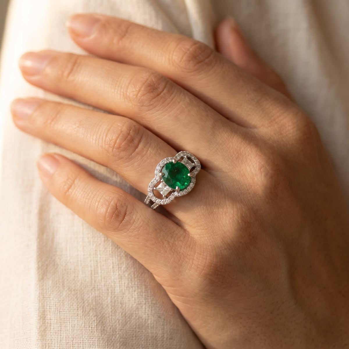 White Gold Emerald Cocktail Ring with Diamond Halo, worn