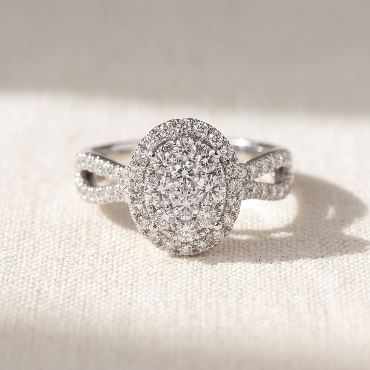White Gold Oval Diamond Cluster Split Shank Engagement Ring