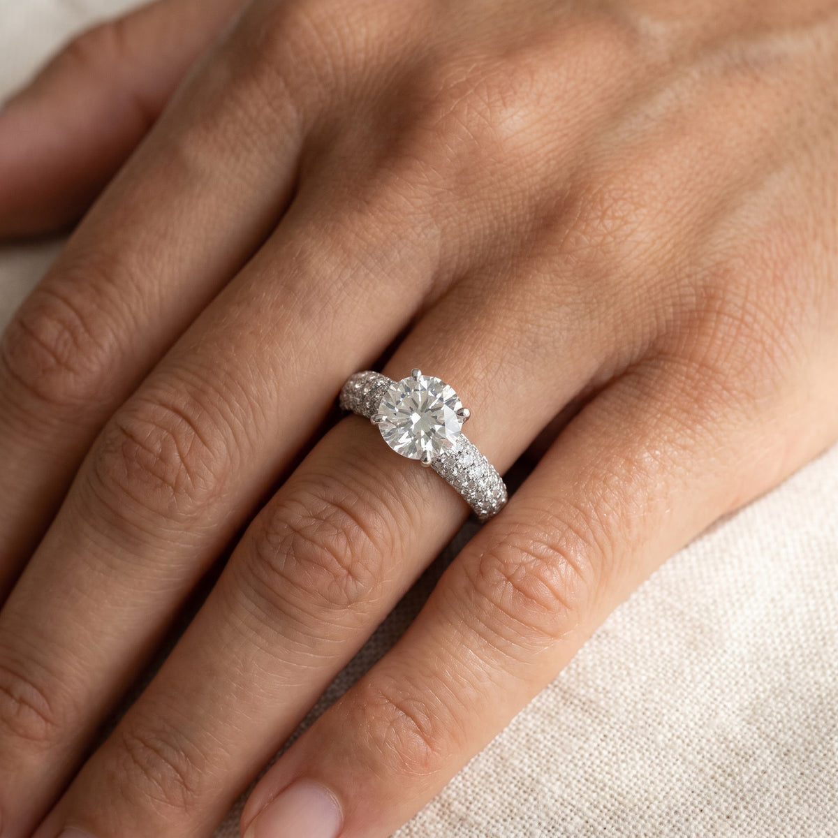 White Gold Round Diamond Ring with Pavé Band, worn