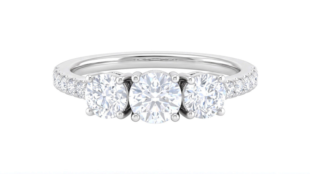 White Gold Three-Stone Diamond Ring with Pavé Band, studio