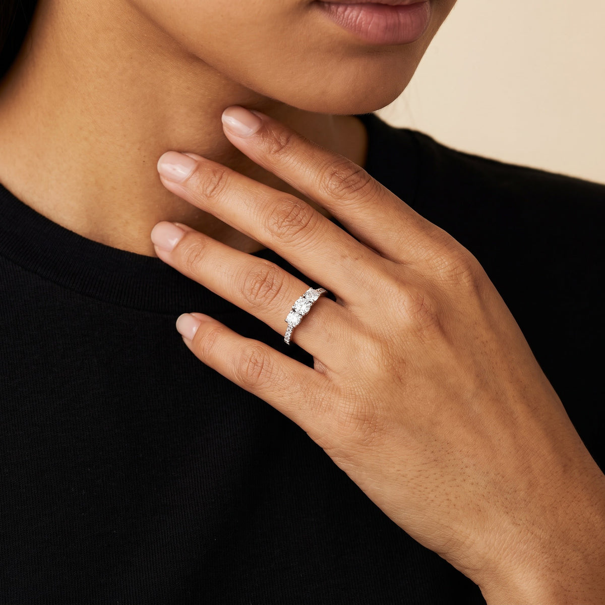 White Gold Three-Stone Diamond Ring with Pavé Band, worn