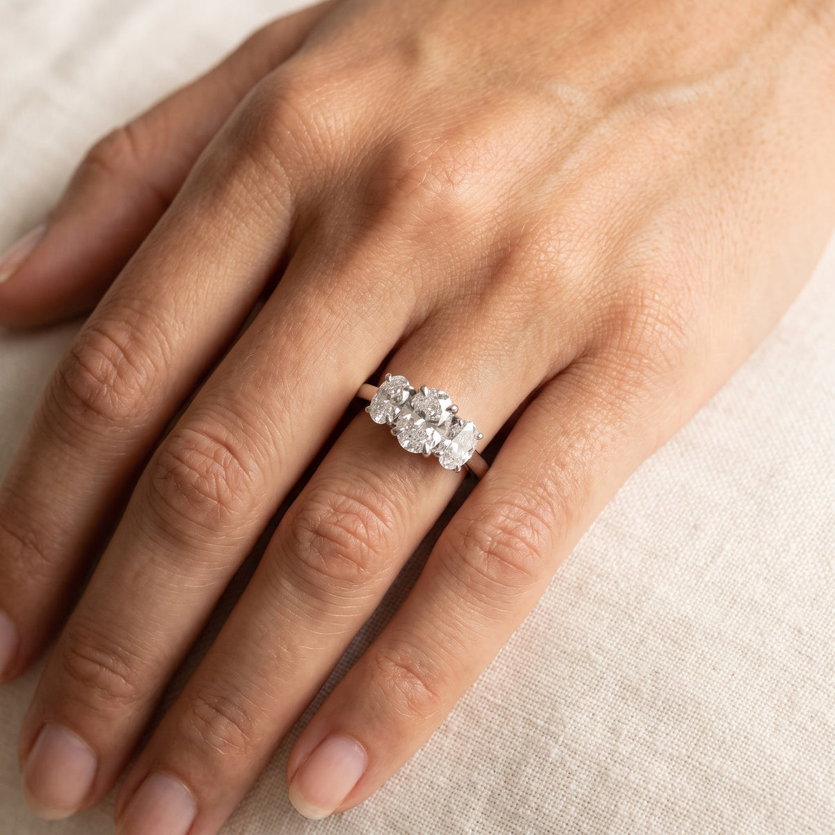 White Gold Three-Stone Oval Diamond Ring, worn