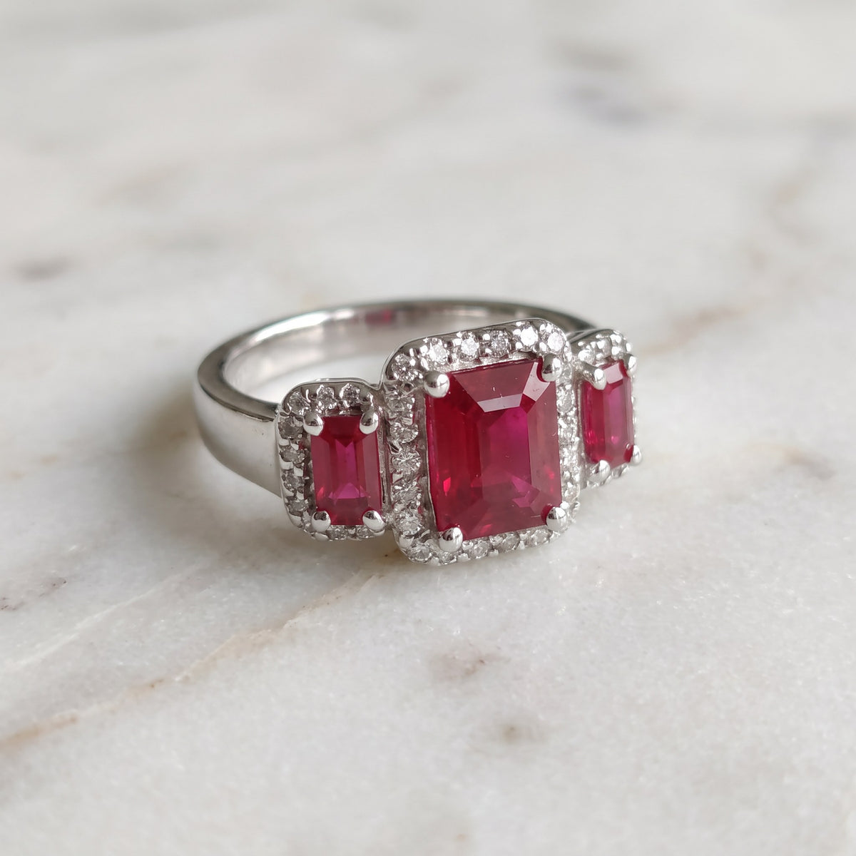 White Gold Three-Stone Ruby Halo Ring