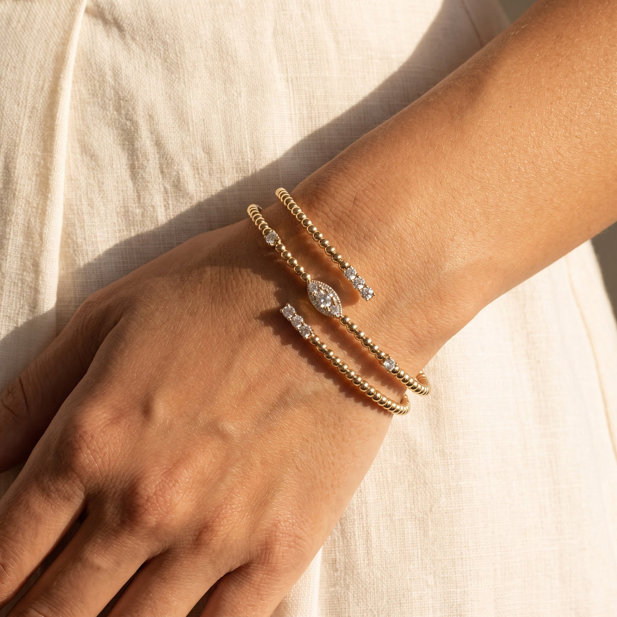 Yellow Gold Beaded Wrap Bracelet with Diamond Accents, worn