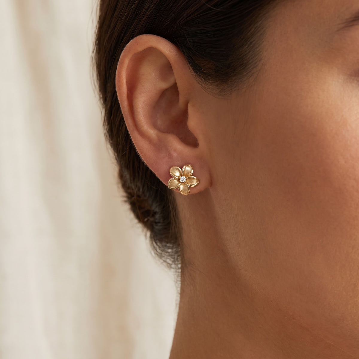Yellow Gold Diamond Plumeria Stud Earrings, worn