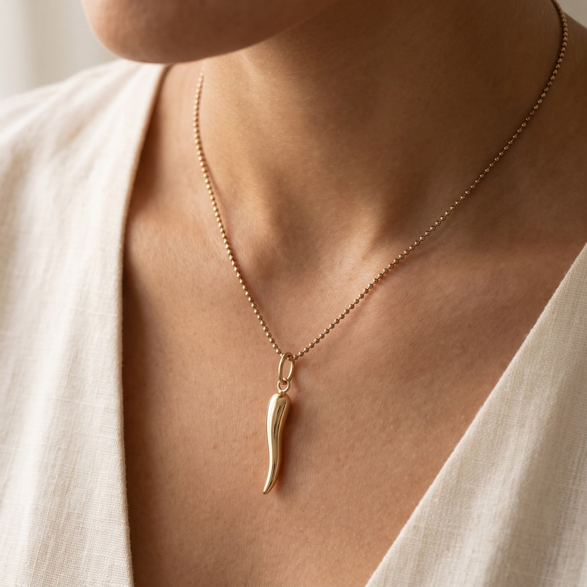 Yellow Gold Horn Charm Necklace on Bead Chain, worn