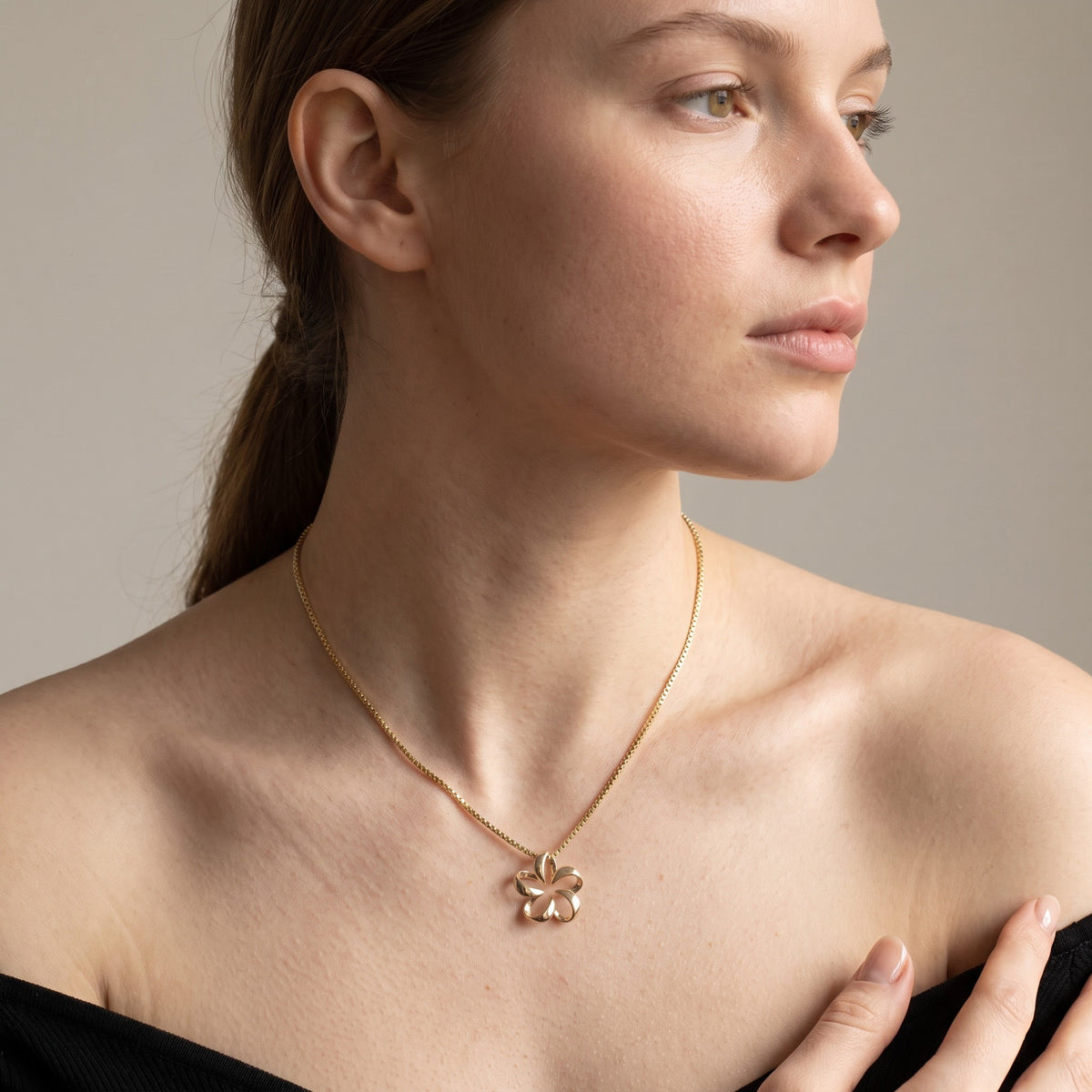 Yellow Gold Open Petal Floral Charm Necklace, worn, second view