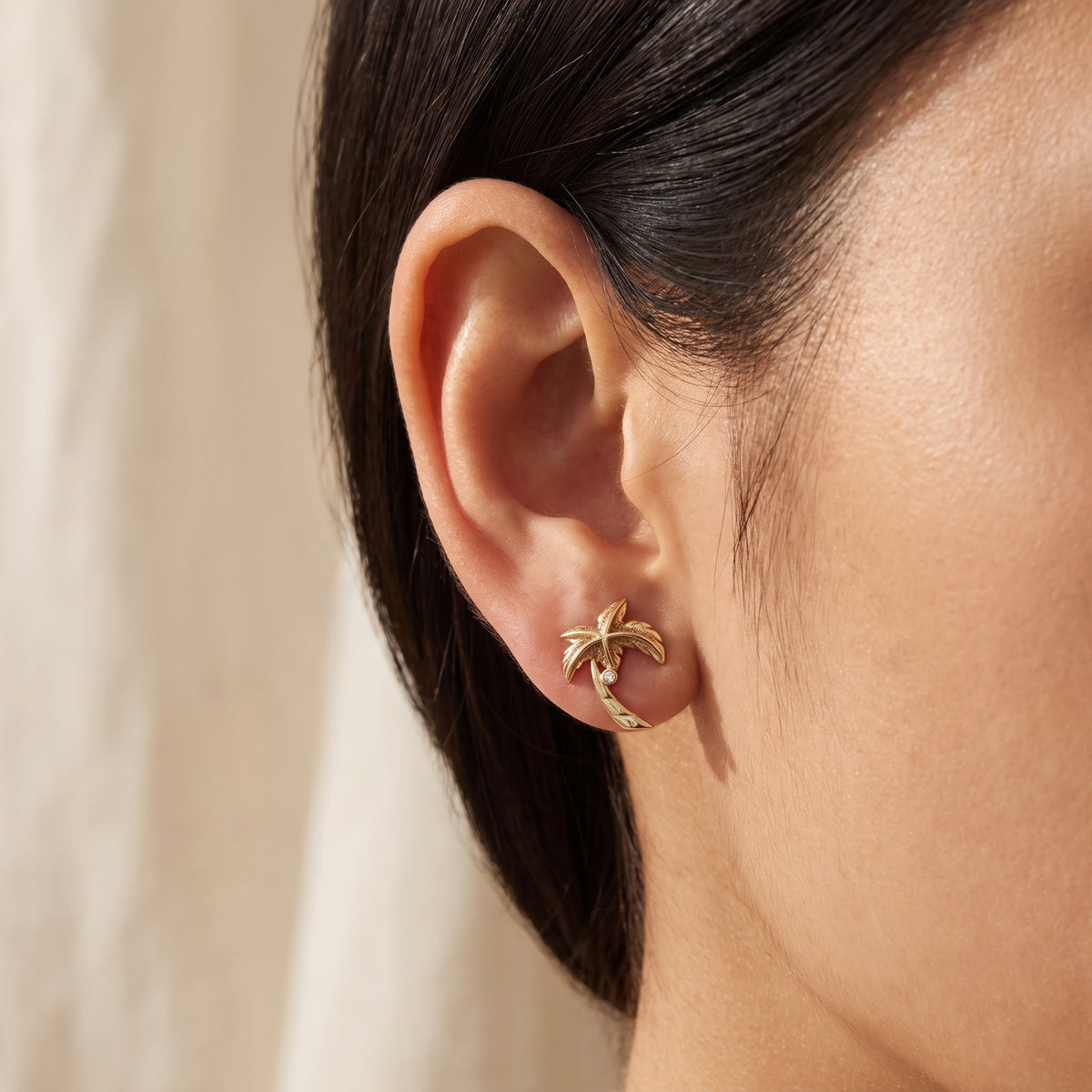 Yellow Gold Palm Tree Stud Earrings with Diamond Accents, worn