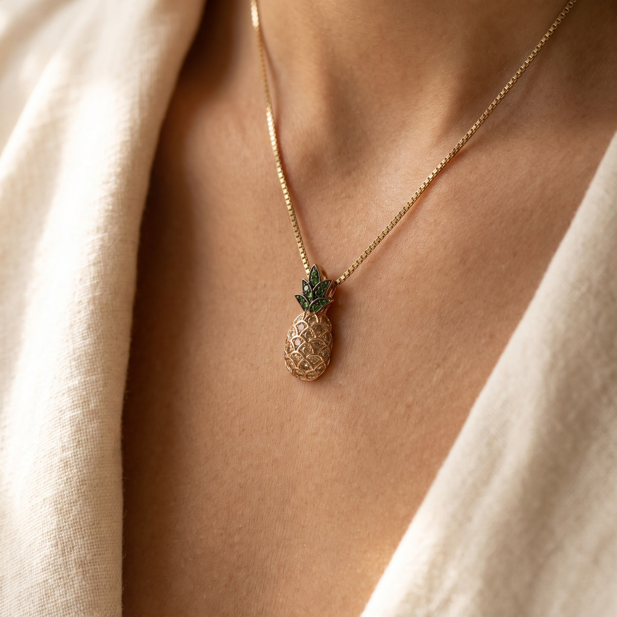 Yellow Gold Pineapple Pendant with Green Stones and Cognac Diamonds, worn