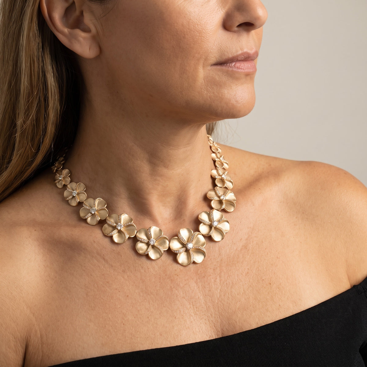 Matte Yellow Gold Plumeria Necklace with Diamond-Accented Petals, worn, second view