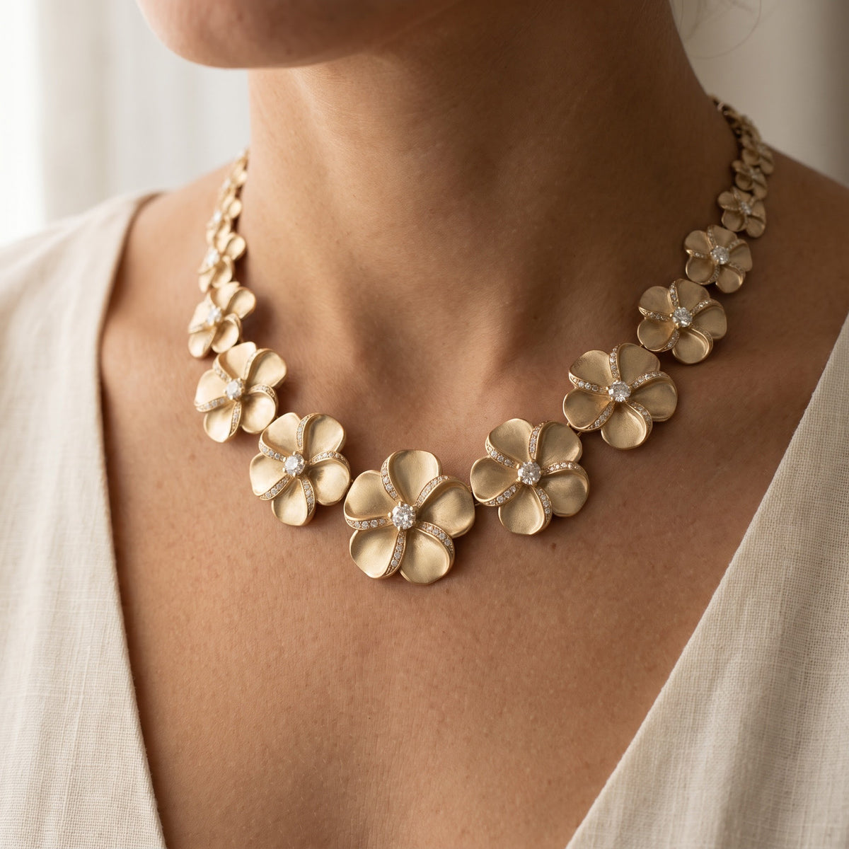 Matte Yellow Gold Plumeria Necklace with Diamond-Accented Petals, worn