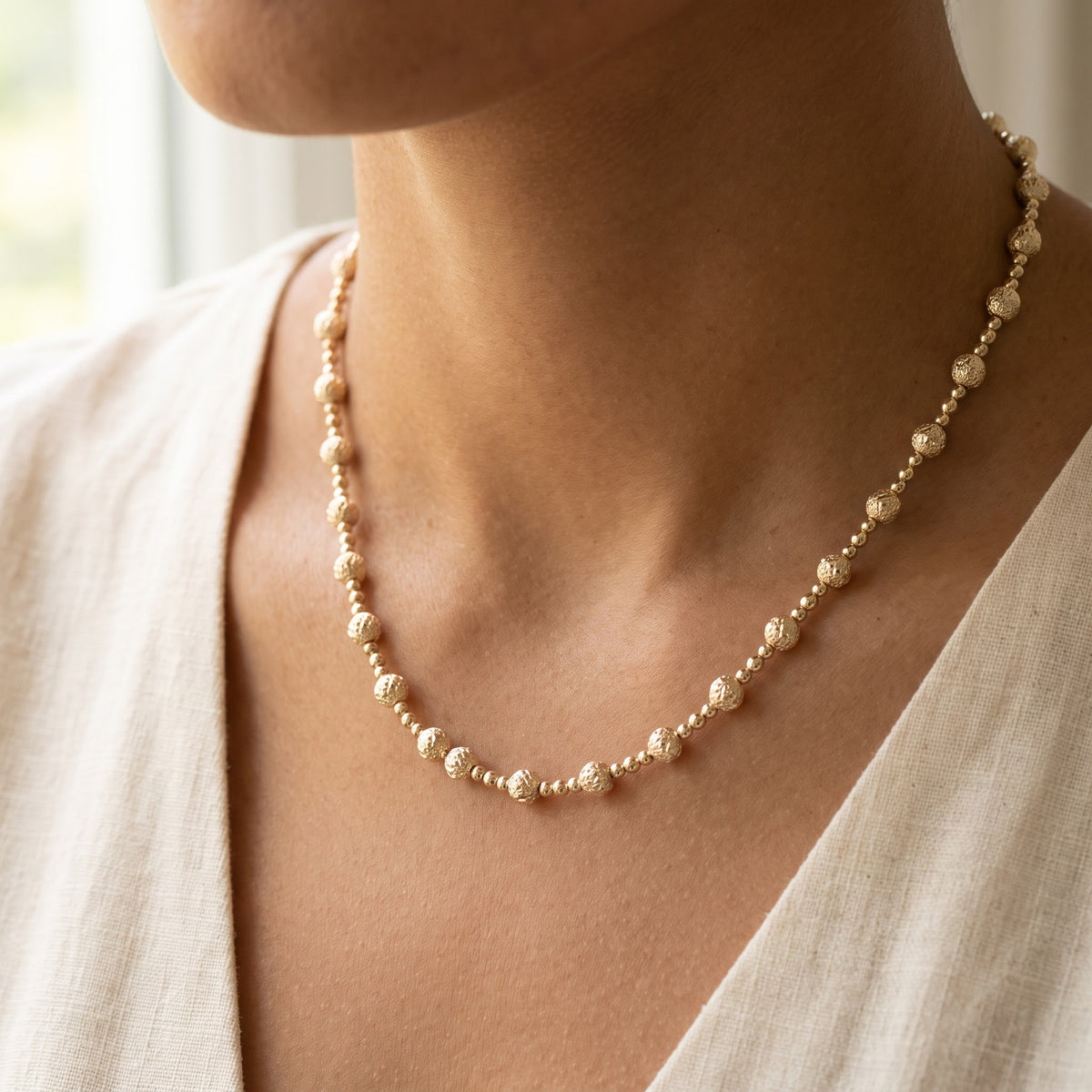 Yellow Gold Textured Beaded Necklace, worn