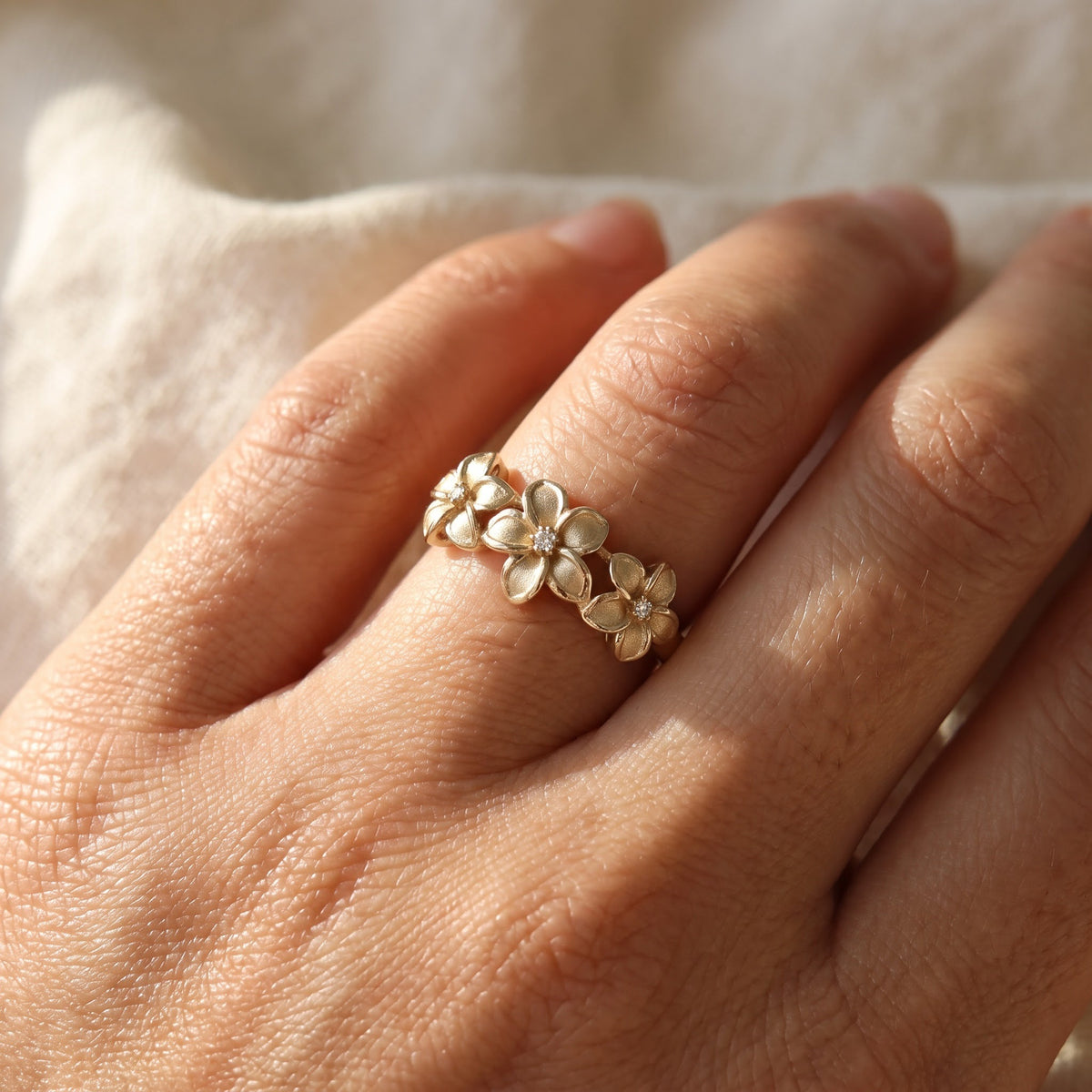Yellow Gold Triple Plumeria Diamond Stackable Ring, worn